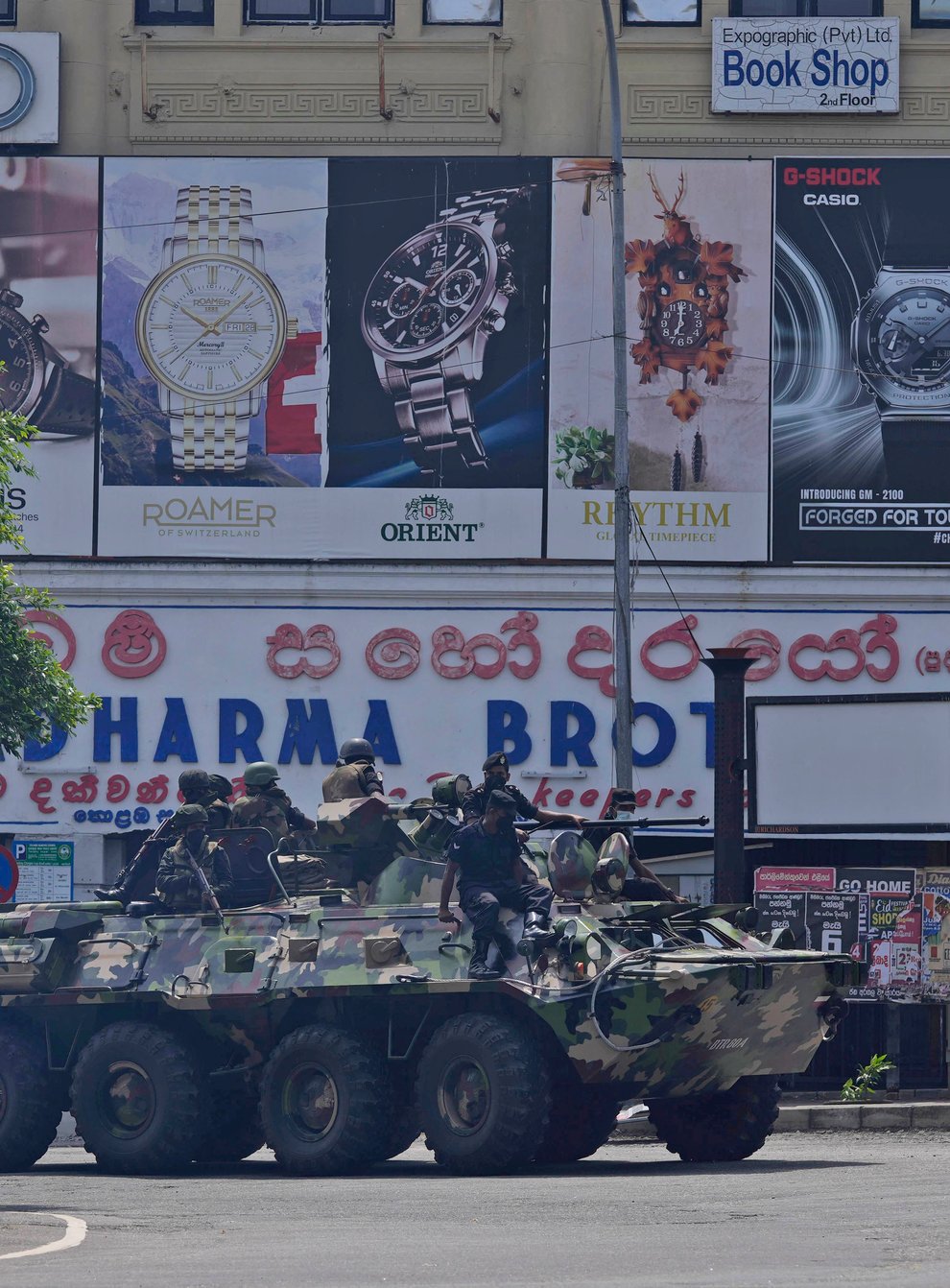 Sri Lankan army soldiers patrol during curfew in Colombo (Eranga Jayawardena/AP)