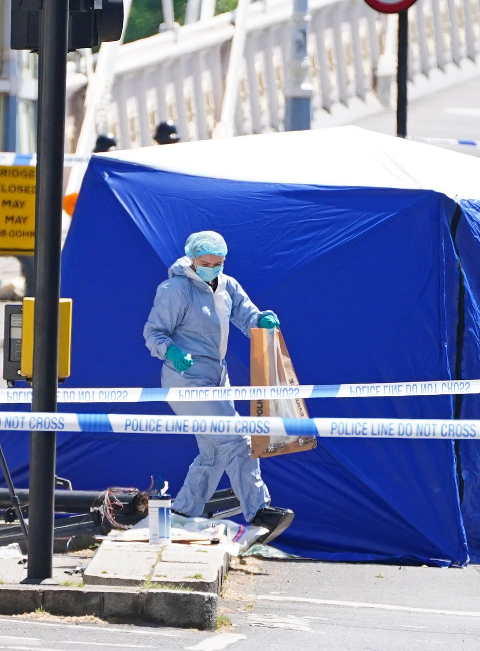 A police forensic officer at the scene of the crash in Chelsea, west London (Dominic Lipinski/PA)
