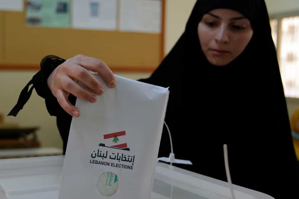 A woman votes during parliamentary elections in Beirut, Lebanon (Hassan Ammar/AP)