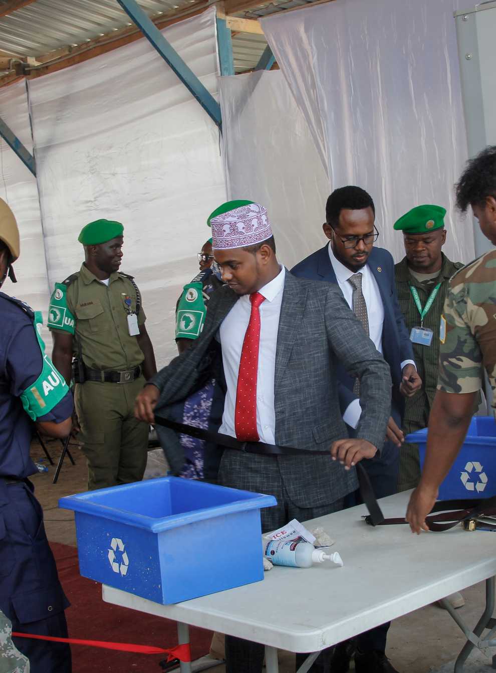 Somali lawmakers are checked by security forces as they arrive to cast their vote in the presidential election, at the Halane military camp which is protected by African Union peacekeepers, in Mogadishu, Somalia Sunday, May 15, 2022. (Farah Abdi Warsameh/AP)
