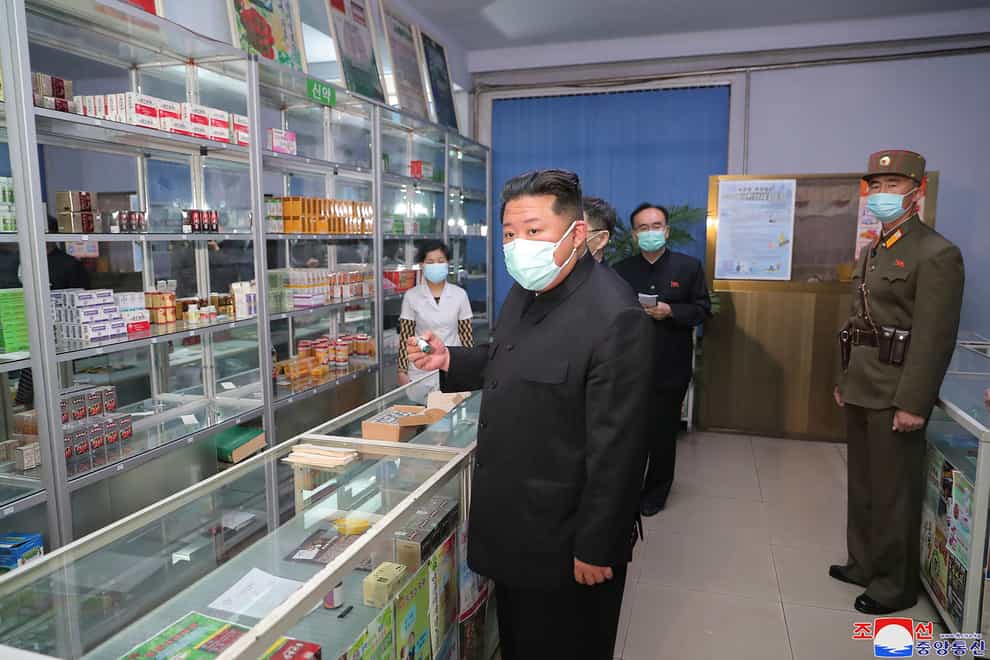 North Korean leader Kim Jong Un, centre, visits a pharmacy in Pyongyang (Korean Central News Agency/Korea News Service/AP)