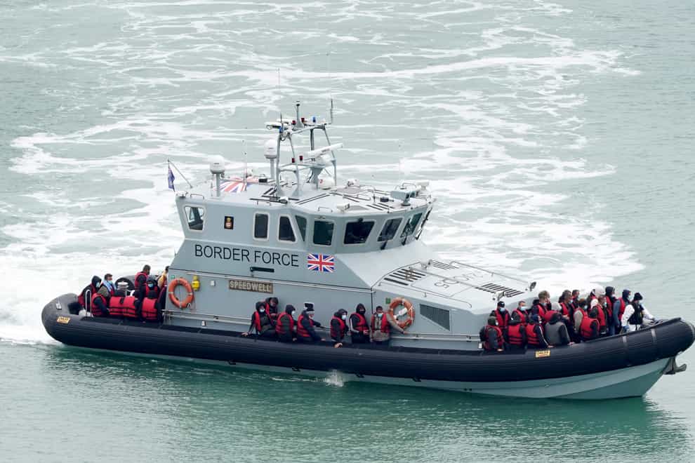 A group of people thought to be migrants are brought in to Dover, Kent, on board a Border Force vessel (Gareth Fuller/PA)