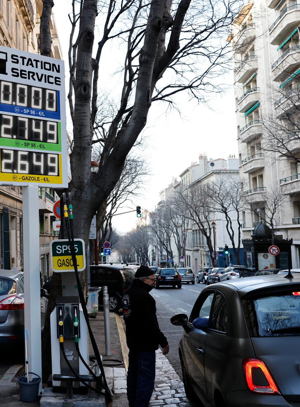 A car stops at a petrol station in Marseille, southern France (Jean-Francois Badias/AP)