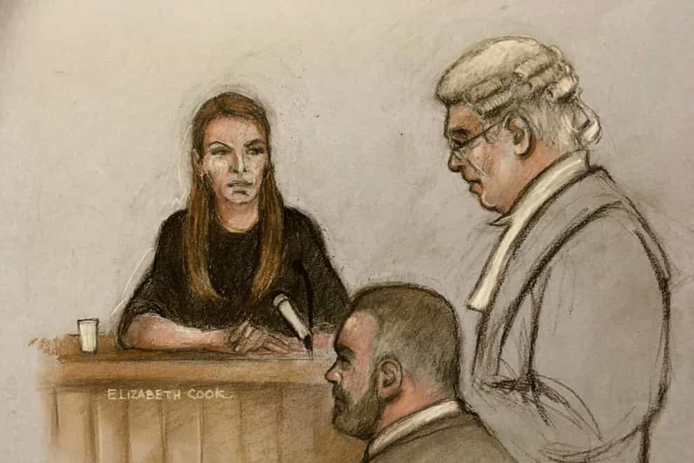 Court artist sketch by Elizabeth Cook of Coleen Rooney, watched by her husband Wayne, with barrister Hugh Tomlinson QC, counsel for Rebekah Vardy at the Royal Courts Of Justice, London, during the high-profile libel battle between herself and Rebekah Vardy. Picture date: Monday May 16, 2022.