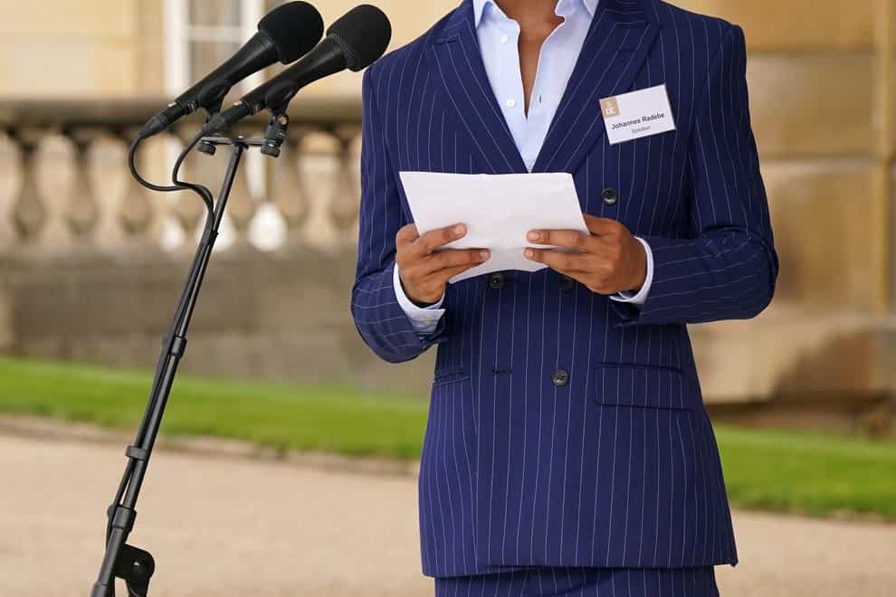 Johannes Radebe makes a speech on the steps of Buckingham Palace during the Duke of Edinburgh Gold Award presentations (Jonathan Brady/PA)