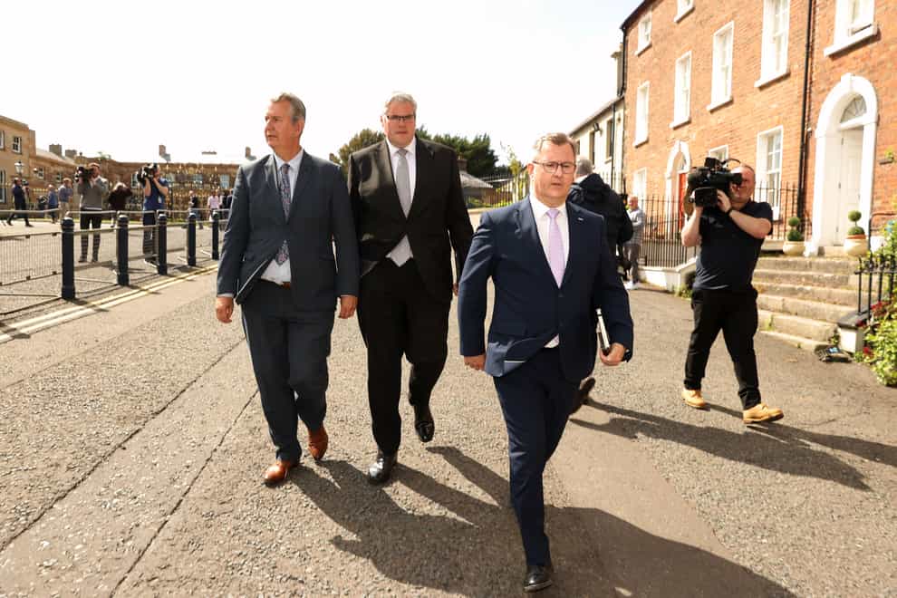 DUP leader Sir Jeffrey Donaldson (right), leaves Hillsborough Castle with colleagues Gavin Robinson MP (centre), and Edwin Poots MLA (left) (Liam McBurney/PA)