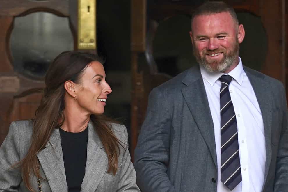 Coleen and Wayne Rooney at the Royal Courts Of Justice (PA)