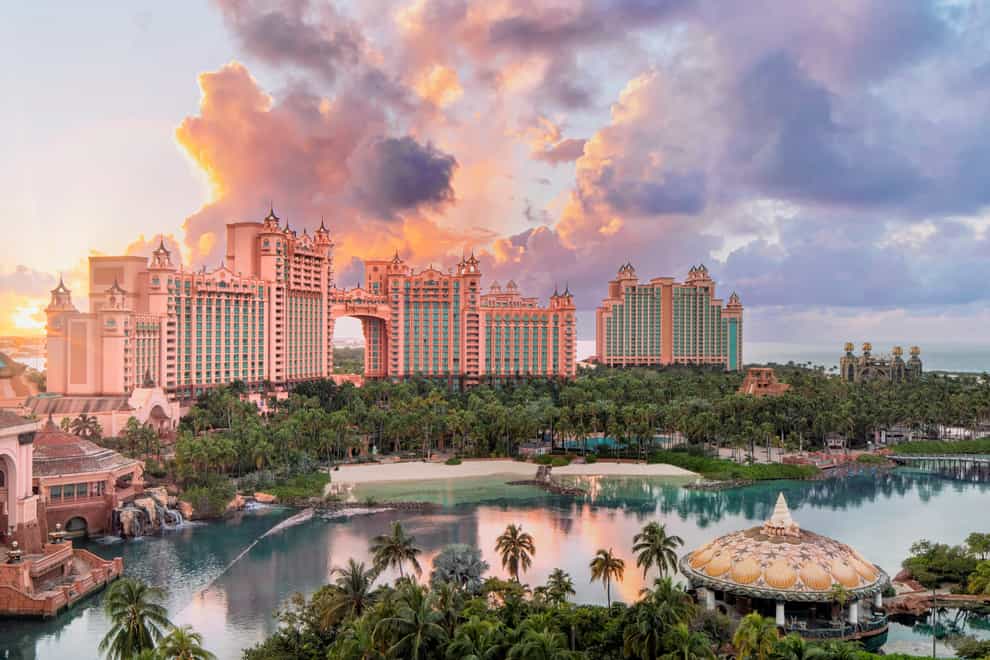 The Cove, right, is one of five hotels at the sprawling Atlantis resort, along with the Royal, left (Atlantis Paradise Island/PA)
