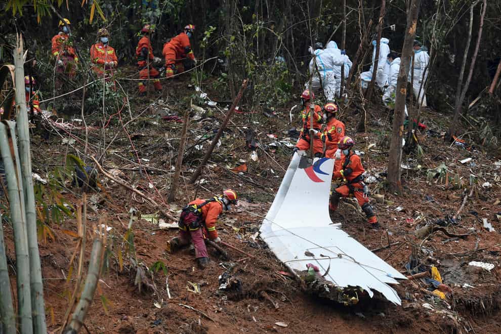 Search and rescue workers at the crash site in southern China’s Guangxi Zhuang Autonomous Region (Lu Boan/Xinhua via AP)