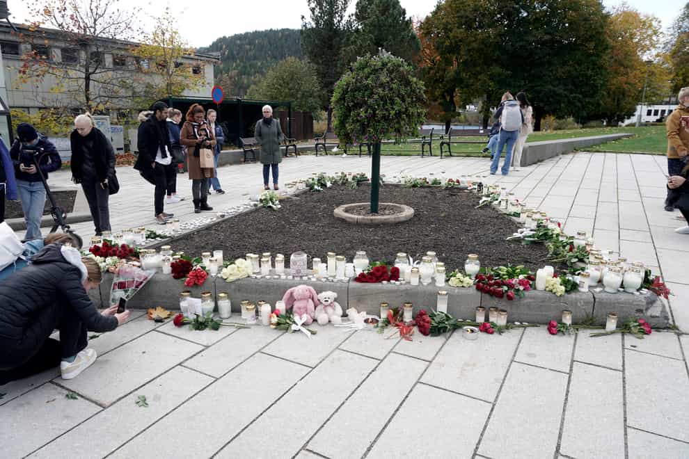 Flowers and candles left in Kongsberg following the attacks (Terje Pedersen/NTB via AP)
