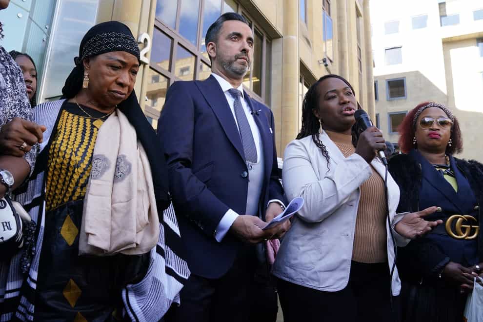 Sheku’s Bayoh’s mother and sisters with lawyer Aamer Anwar outside the inquiry (Andrew Milligan/PA)
