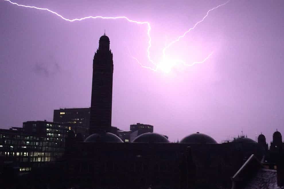 Lightning flashes over the tower of Westminster Cathedral (Adam Peck/PA)