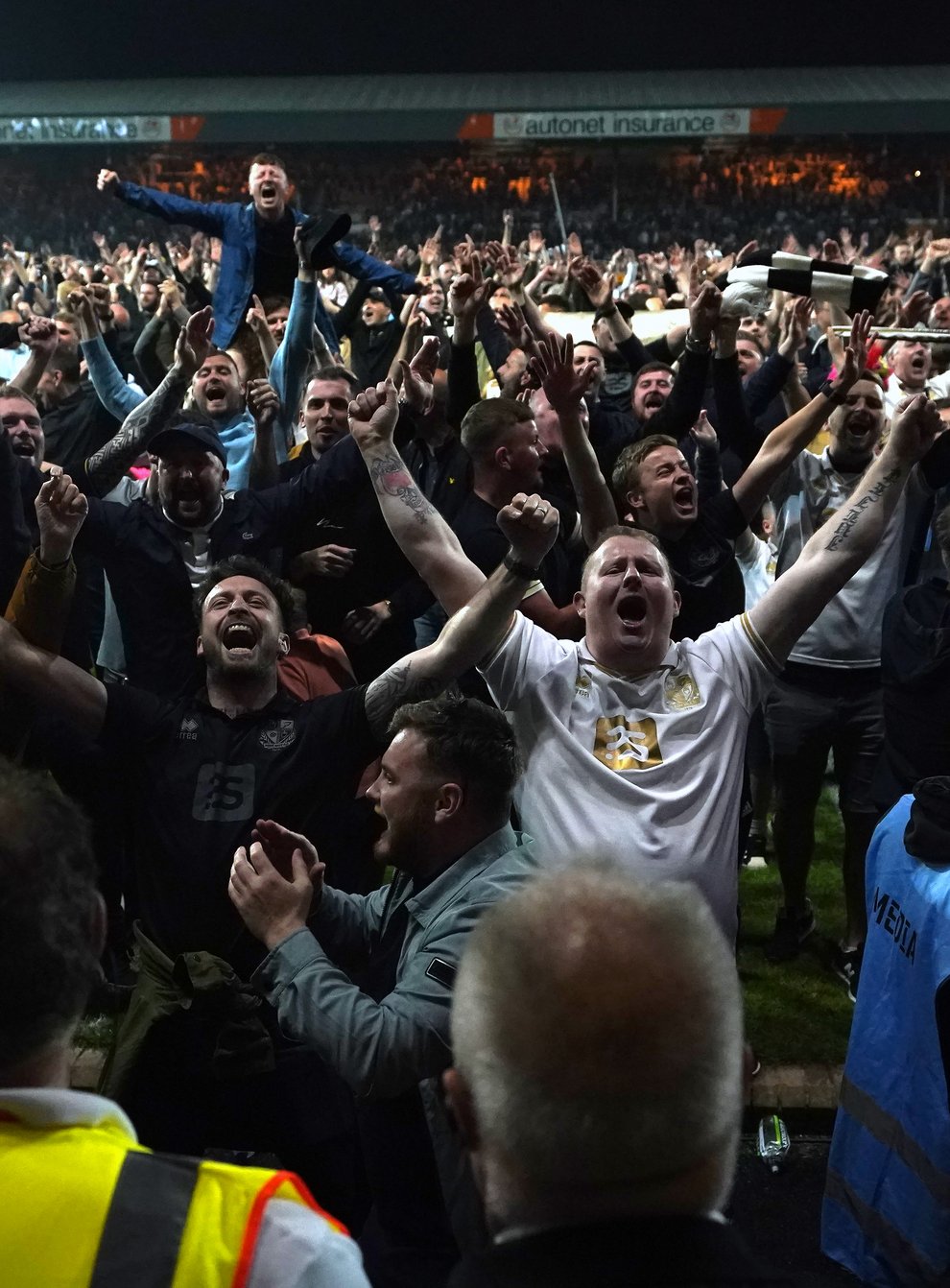 Port Vale fans invaded the pitch after victory in a penalty shoot-out against Swindon (Nick Potts/PA)