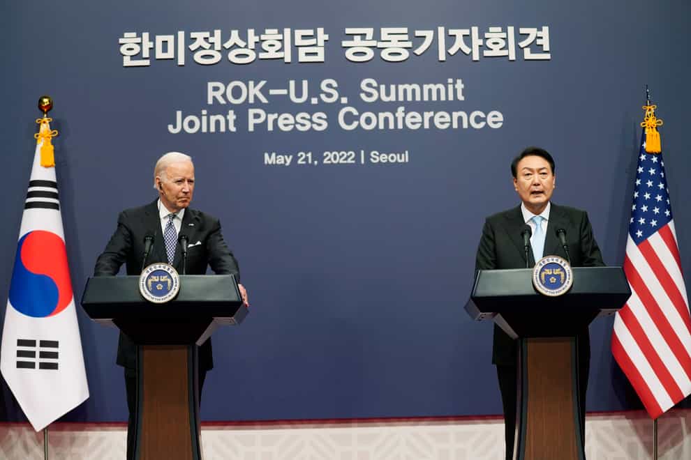 US President Joe Biden listens to South Korean President Yoon Suk Yeol speak during a news conference at the People’s House inside the Ministry of National Defence in Seoul (Evan Vucci/AP)