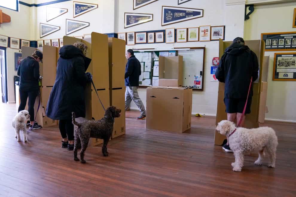 Citizens cast their votes at a polling booth in Sydney, Australia (Mark Baker/AP)