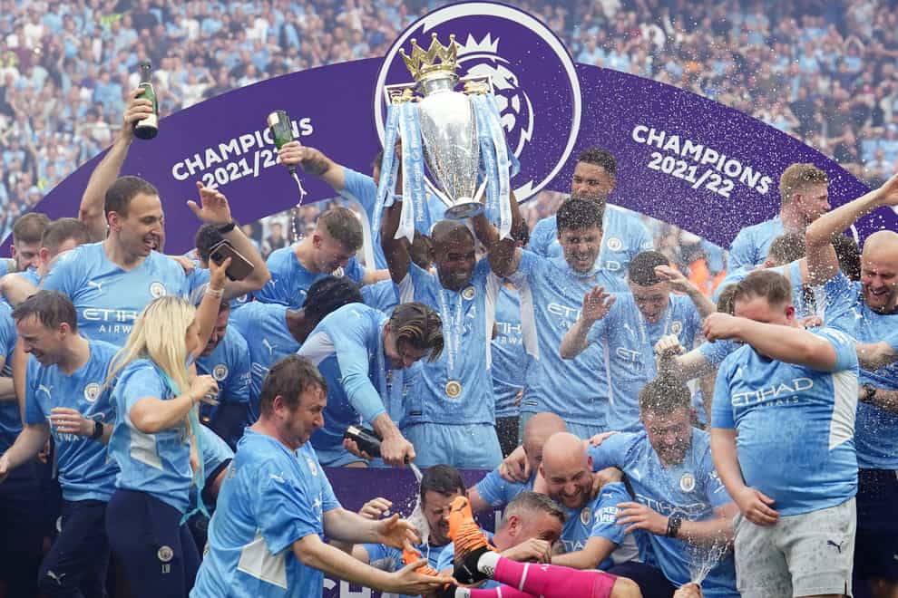 Manchester City’s Fernandinho lifts the Premier League trophy – the club’s fourth in five seasons (Martin Rickett/PA)