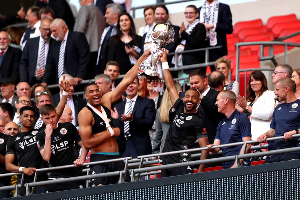 Bromley’s Omar Sowunmi (left) and Liam Trotter lift the FA Trophy following their Wembley victory over Wrexham (Kieran Cleeves/PA)