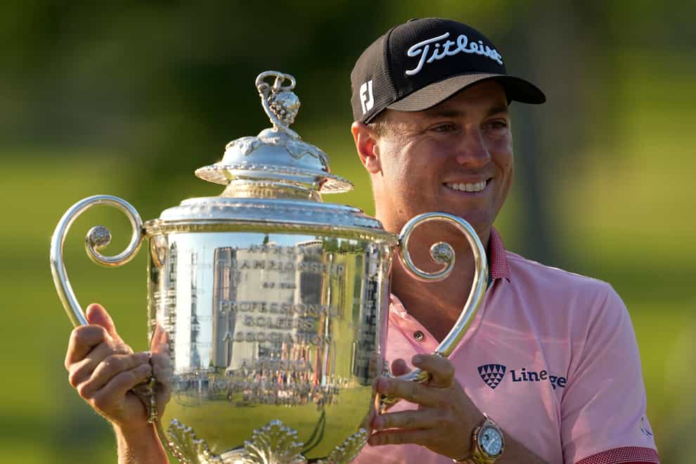 Justin Thomas poses with the Wanamaker Trophy after winning the US PGA Championship (Matt York/AP)