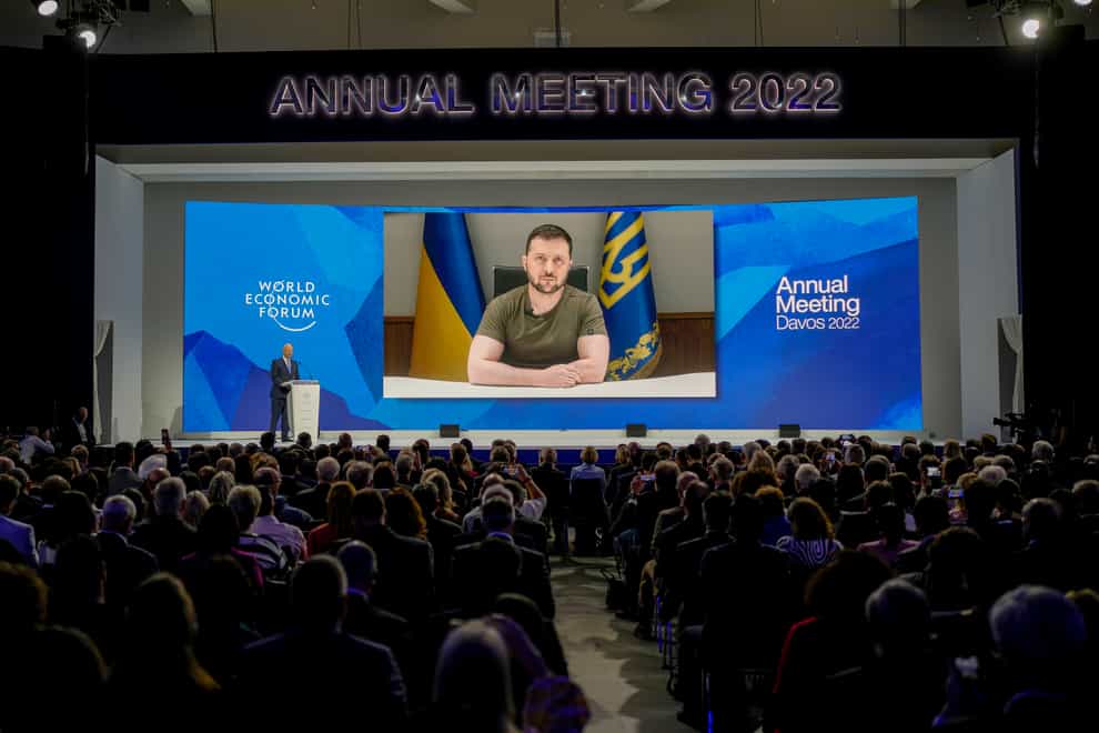 Ukrainian President Volodymyr Zelensky displayed on a screen as he addresses the audience from Kyiv on a screen during the World Economic Forum in Davos, Switzerland, on Monday May 23 2022 (Markus Schreiber/AP)