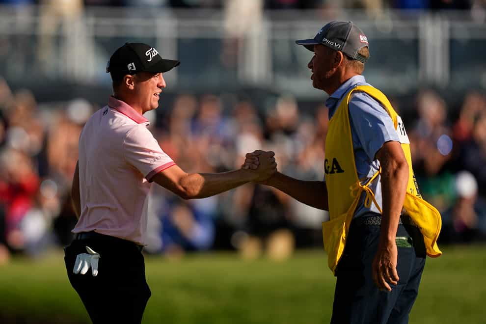 Justin Thomas celebrates with his caddie Jim “Bones” Mackay after winning the US PGA Championship (Eric Gay/AP)