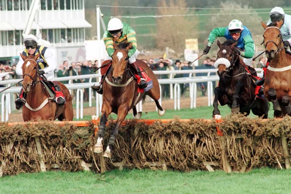 Charlie Swan on favourite Istabraq leads over the final hurdle to win the Royal Sun Alliance Novices Hurdle (David Jones/PA)
