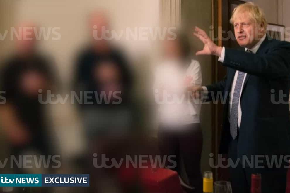 A photograph obtained by ITV News of the Prime Minister raising a glass at a leaving party on 13th November 2020 (ITV/PA)