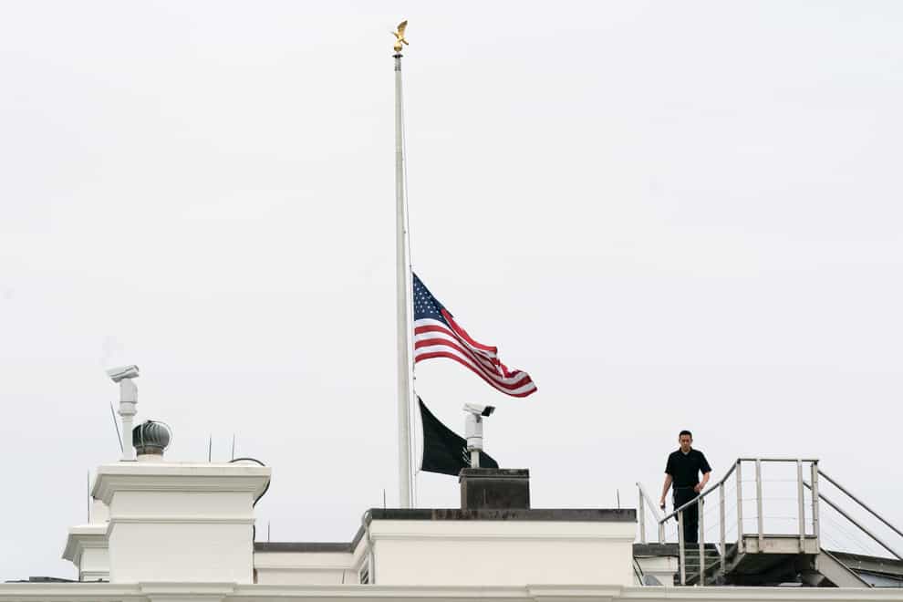 An American flag flies at half-mast at the White House in Washington, to honour the victims of the mass shooting at Robb Elementary School in Uvalde, Texas (Manuel Balce Ceneta/AP)