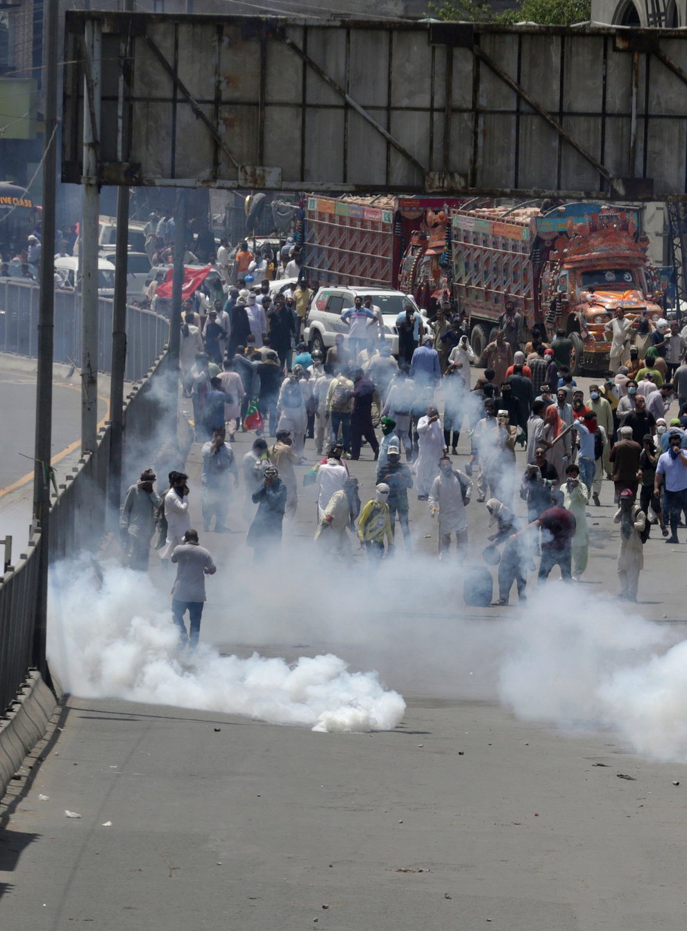 Police fire tear gas to disperse supporters of Pakistan’s key opposition party marching towards Islamabad (KM Chaudary/AP)