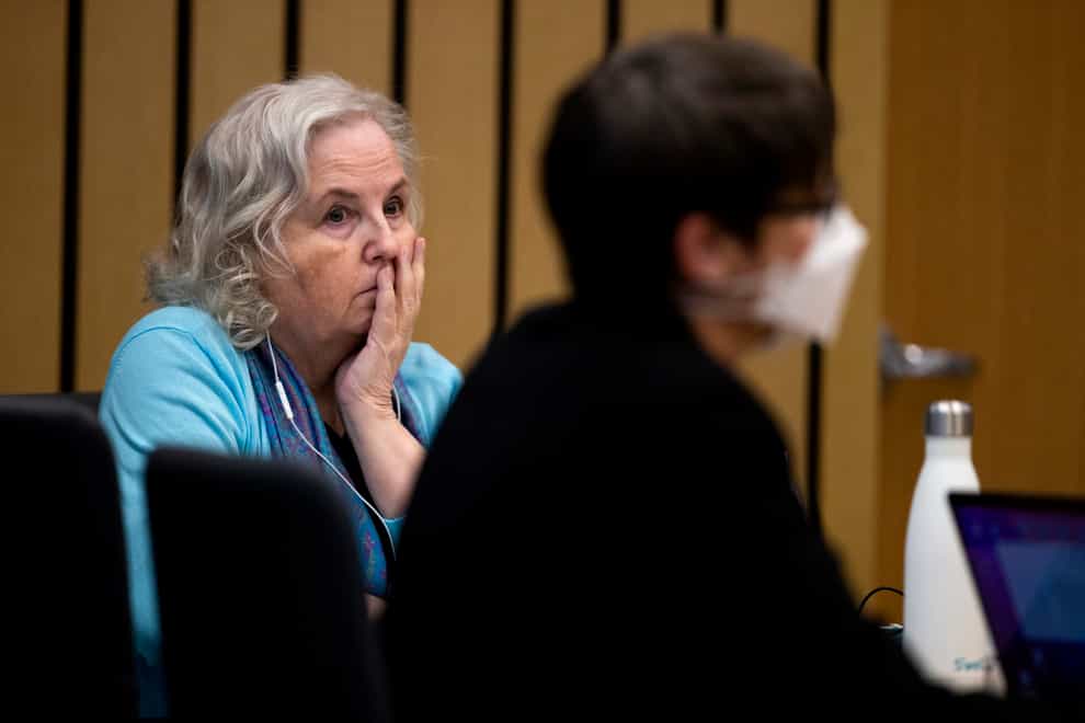 Romance writer Nancy Crampton Brophy, left, watches proceedings in court (Dave Killen/The Oregonian/AP)