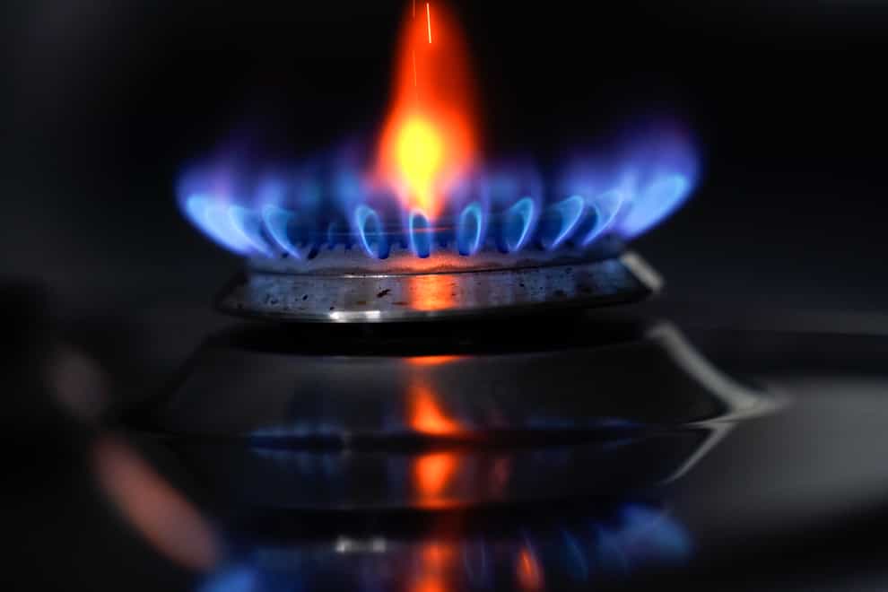 A gas hob burning on a stove in a kitchen (Andrew Matthews/PA)