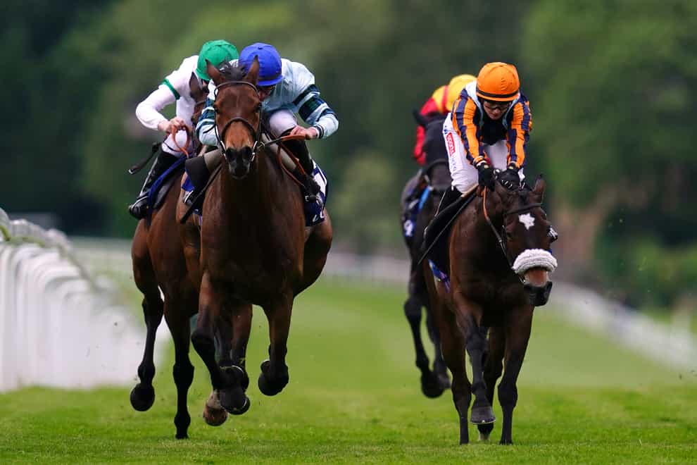 Quickthorn, (blue cap) ridden by Tom Marquand on the way to winning The Coral Henry II Stakes at Sandown Park Racecourse, Esher. Picture date: Thursday May 26, 2022.