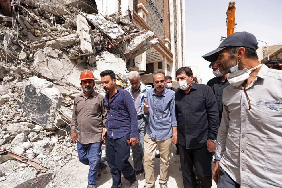 Iranian vice-president Mohammad Mokhber visits the site of a tower at under construction 10-storey Metropol Building (Iranian Senior Vice-President Office via AP)