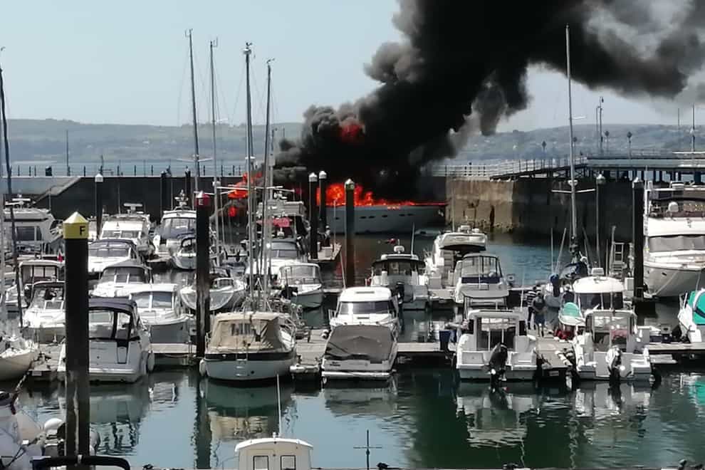 The yacht on fire in Torquay (Cat Johns/PA)