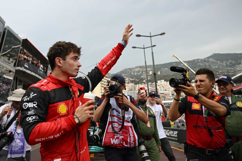 Charles Leclerc celebrates after taking pole position in Monaco (Christian Bruna/AP)