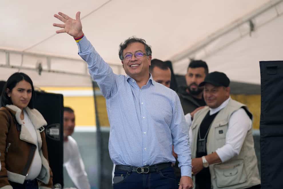 Presidential candidate Gustavo Petro, of the Historical Pact coalition, waves to supporters during a campaign rally in Fusagasuga, Colombia (Fernando Vergara/AP)