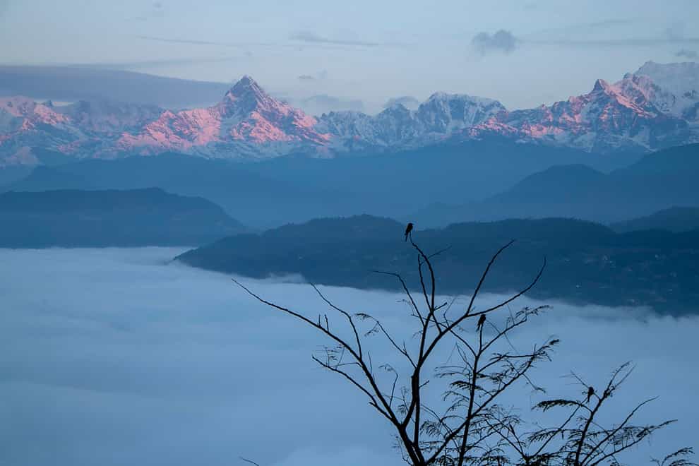 A small plane with 22 people on board is missing in Nepal’s mountains (Niranjan Shrestha/AP)