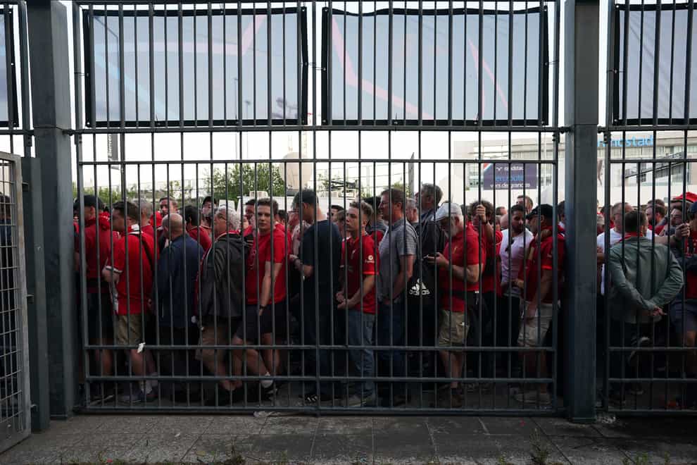 Fans gathered at the perimeter of the Stade de France ahead of the Champions League final in Paris (Nick Potts/PA)
