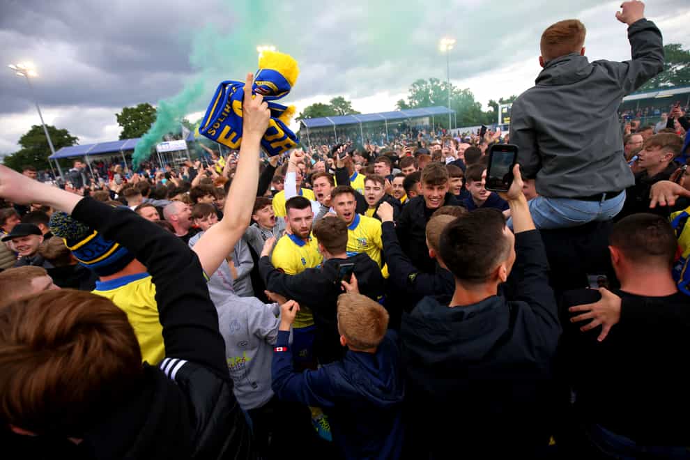 Solihull Moors fans celebrate with the players after the Vanarama National League play-off semi-final victory over Chesterfield (Nigel French/PA)