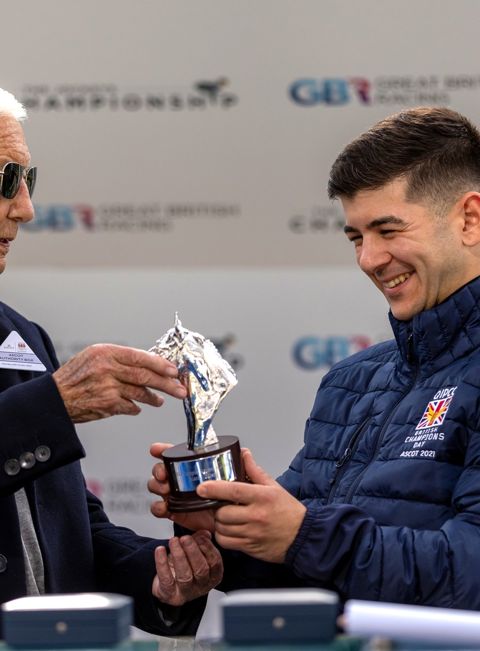 Lester Piggott (left) presents Marco Ghiani with his champion apprentice trophy (Steven Paston/PA)
