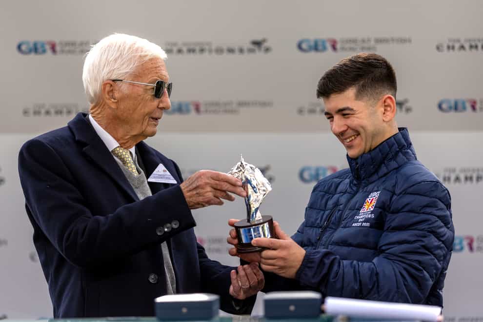 Lester Piggott (left) presents Marco Ghiani with his champion apprentice trophy (Steven Paston/PA)