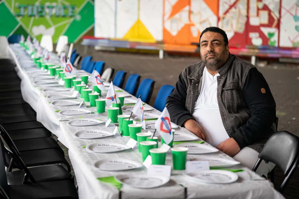 Nabil Choucair, who lost six family members, as a table is laid for 72 absent people in honour of the Queen’s Platinum Jubilee during a Grenfell Jubilee event to remember the victims of the tragedy (Aaron Chown/PA)