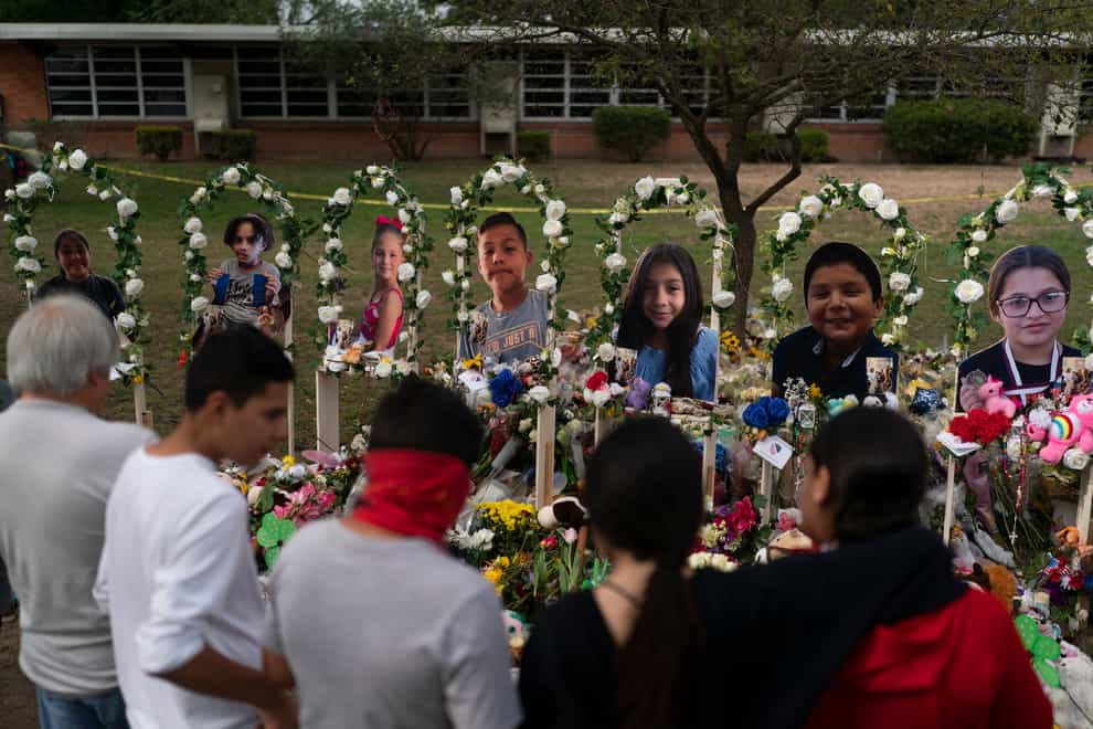 People gather at a memorial at Robb Elementary School in Uvalde, Texas (Jae C. Hong/AP)