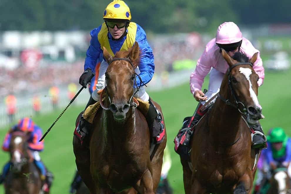 Kris Kin and Kieren Fallon (centre spotted cap) took the 2003 Derby for Sir Michael Stoute (Rebecca Naden/PA)
