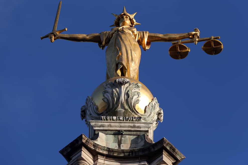 FW Pomeroy’s Statue of Justice stands atop the Central Criminal Court building, Old Bailey, London.