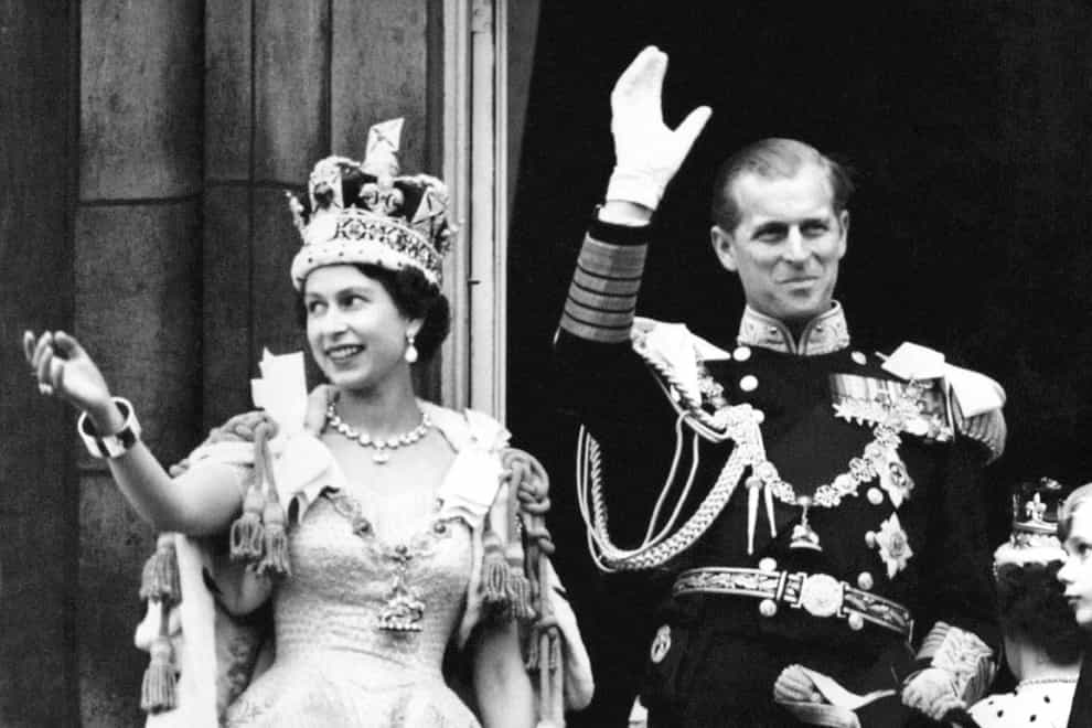 The Queen wearing the Imperial State Crown, and the Duke of Edinburgh, after the Coronation (PA)