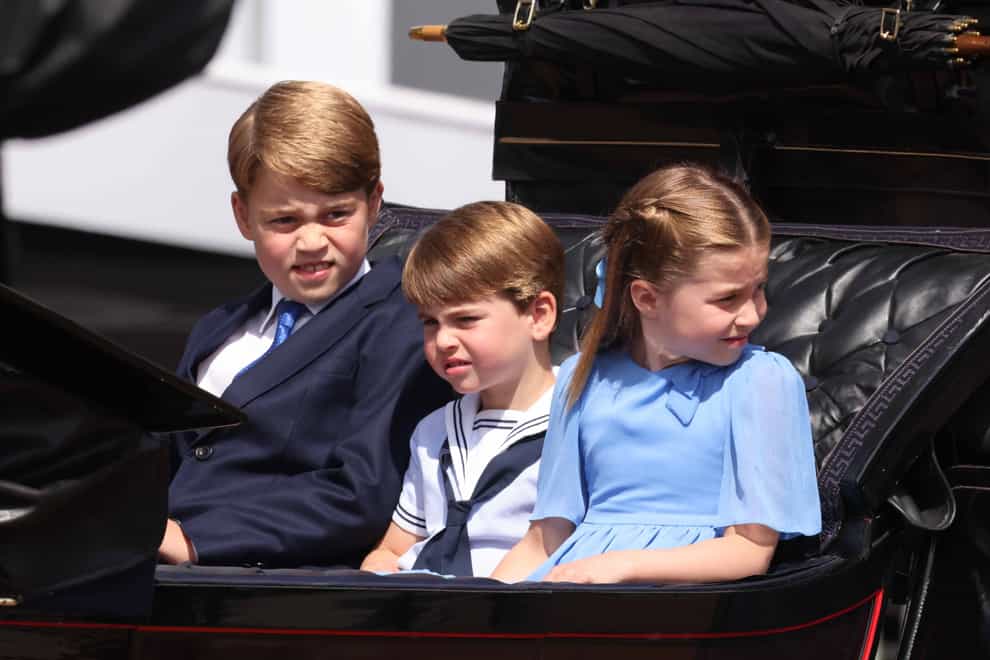 Prince George, Prince Louis and Princess Charlotte ride in a carriage as the Royal Procession leaves Buckingham Palace (Ian Vogler/Daily Mirror/PA)