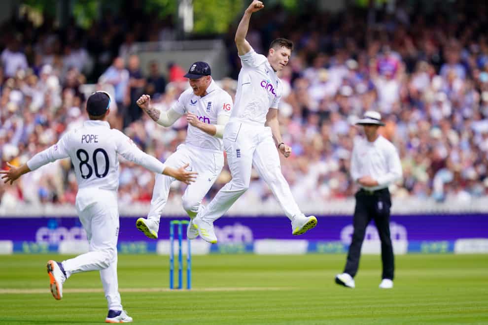 Matthew Potts, right, and Ben Stokes, centre, celebrate the wicket of New Zealand captain Kane Williamson (Adam Davy/PA)