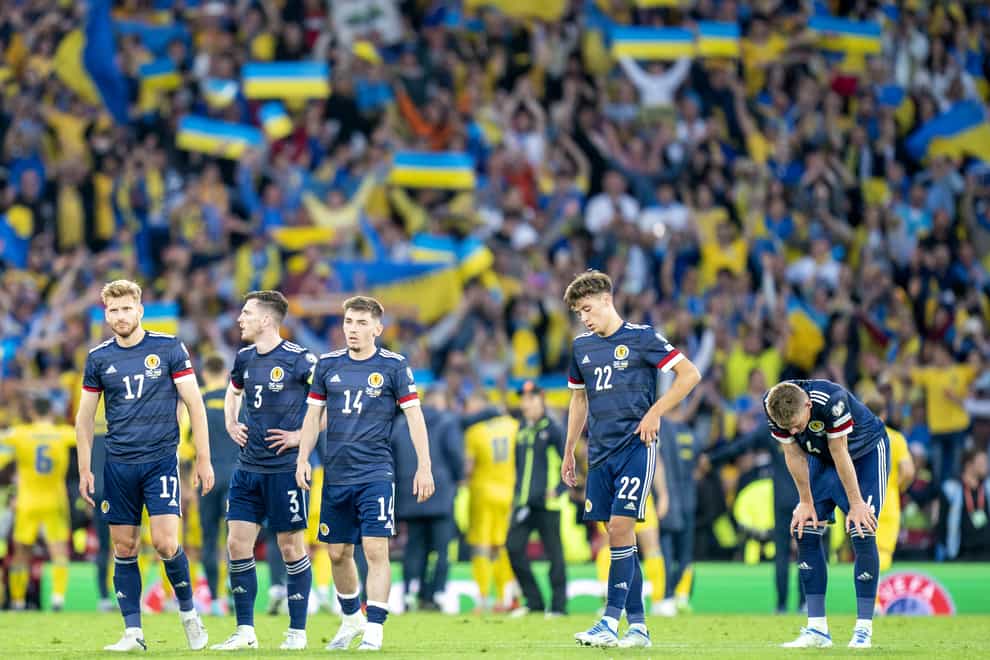 Dejected Scotland players after defeat by Ukraine (Jane barlow/PA)