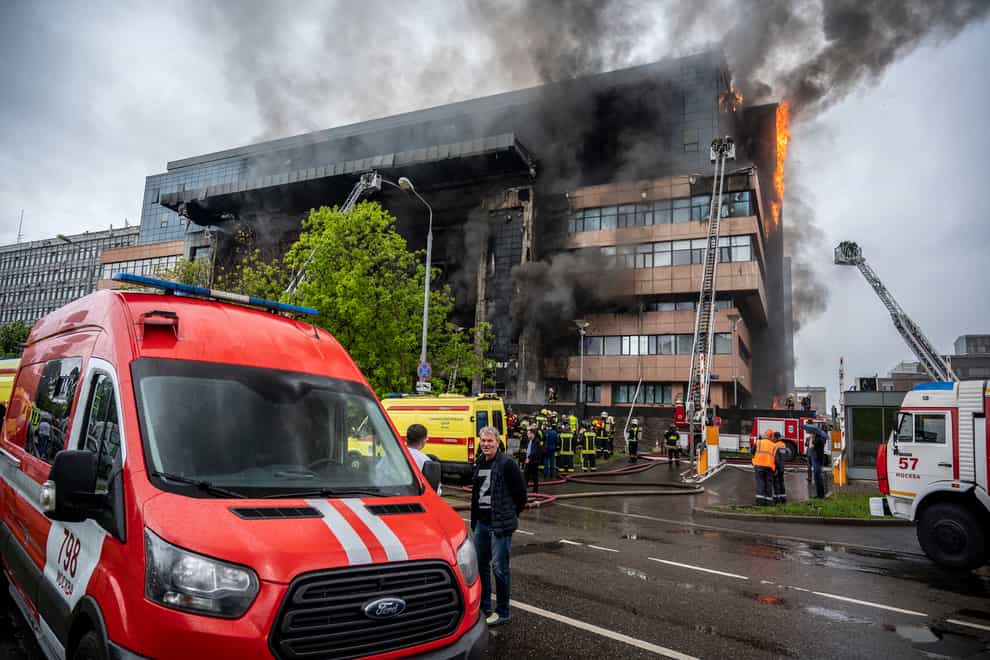 Firefighters at the scene of a blaze that broke out at a business centre in Moscow, Russia (Dmitry Serebryakov/AP)