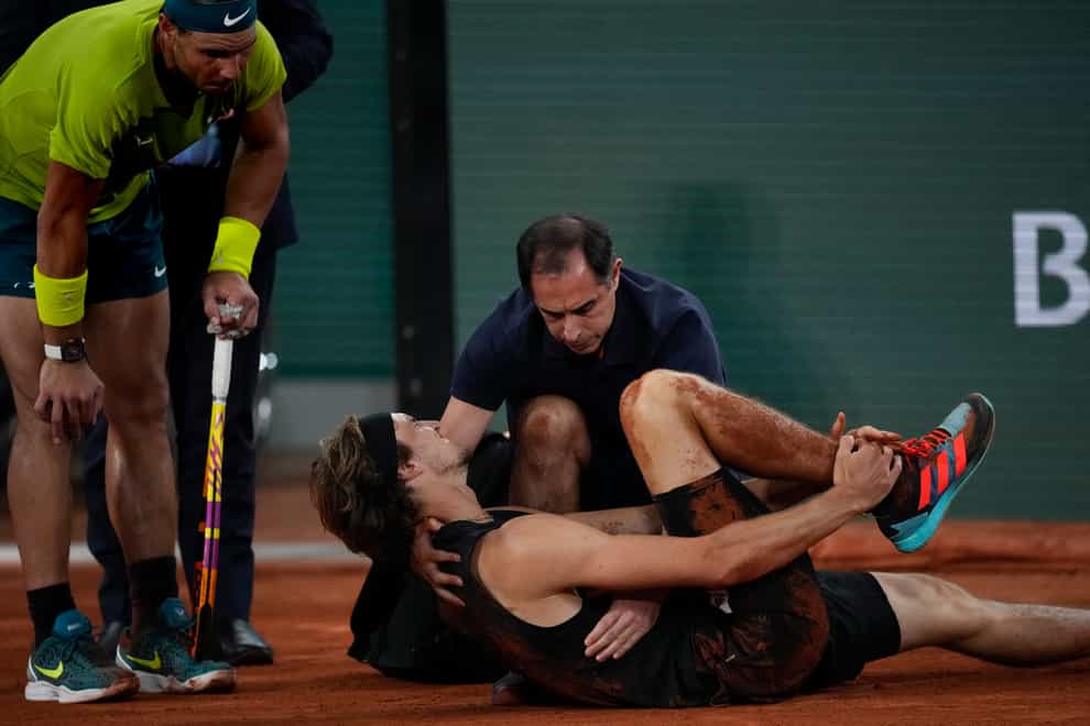 Alexander Zverev retired from the French Open semi-finals after a fall (Christophe Ena/AP)